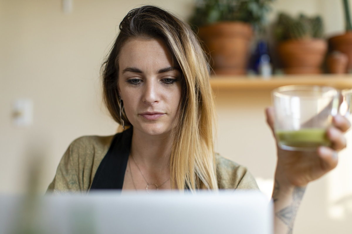 closeup of woman working on her laptop